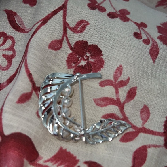 Silver pearly brooch